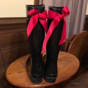 Shiny black rain boots